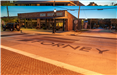 An image of the historic downtown Forney with the word Forney in the brick pavement.  