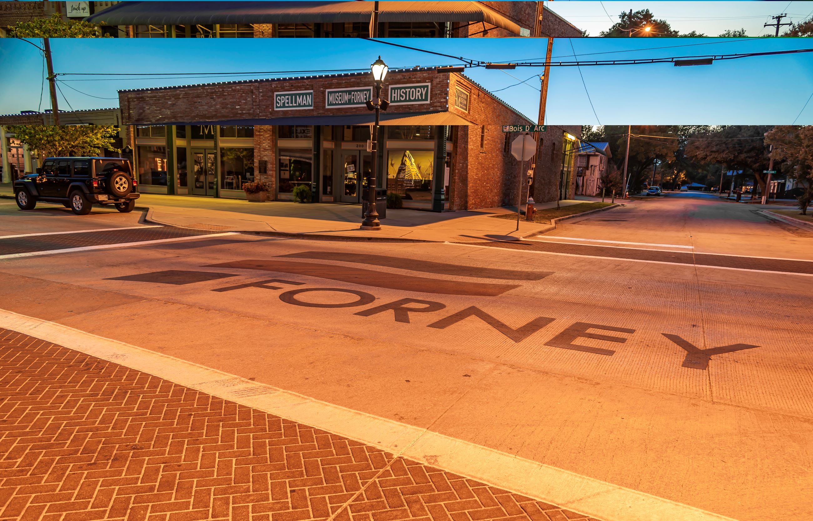 An image of the historic downtown Forney with the word Forney in the brick pavement.  